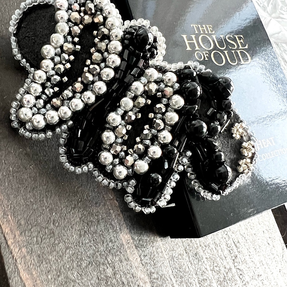 The elegant handmade D beaded barrette.